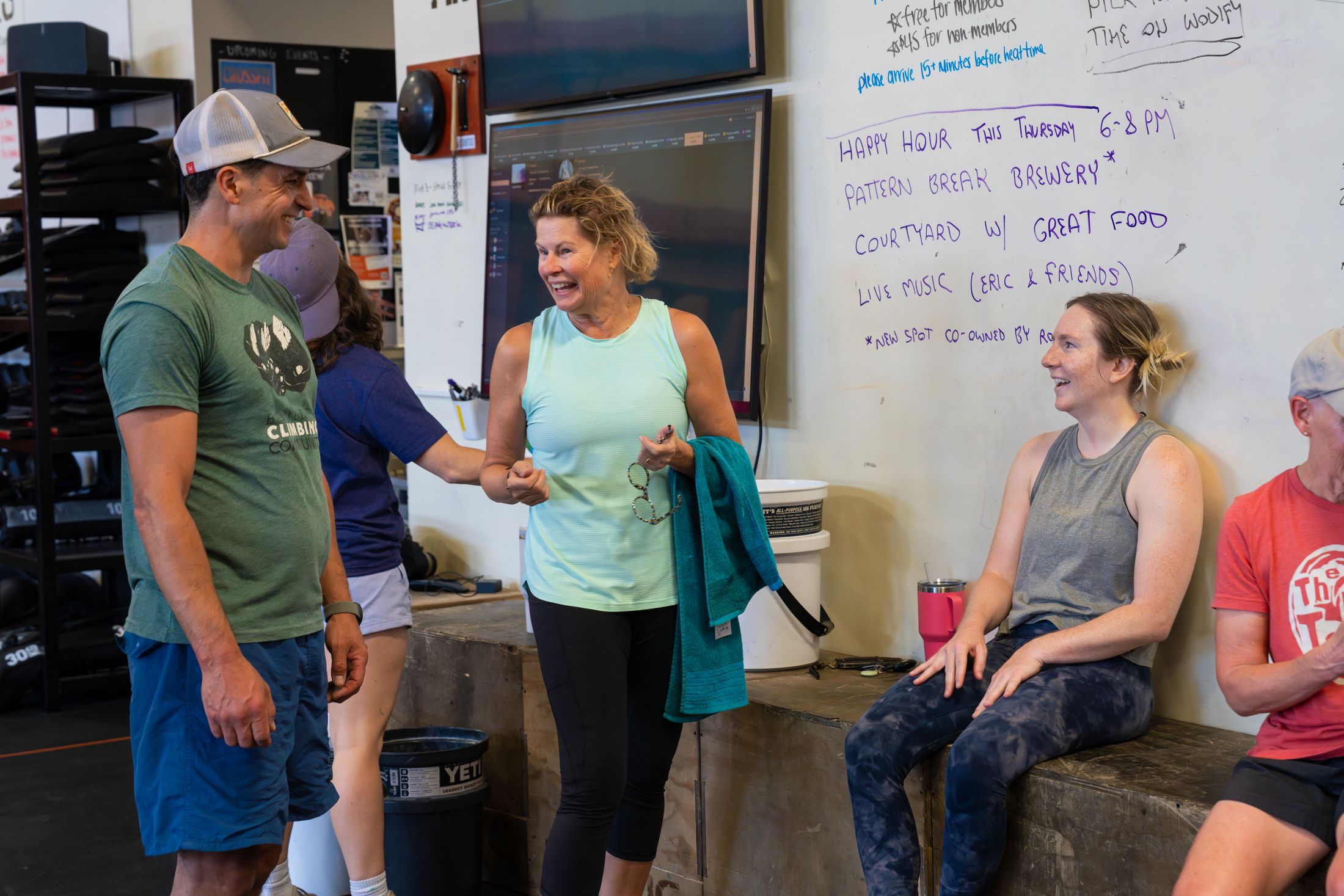 Participants laughing together between sets