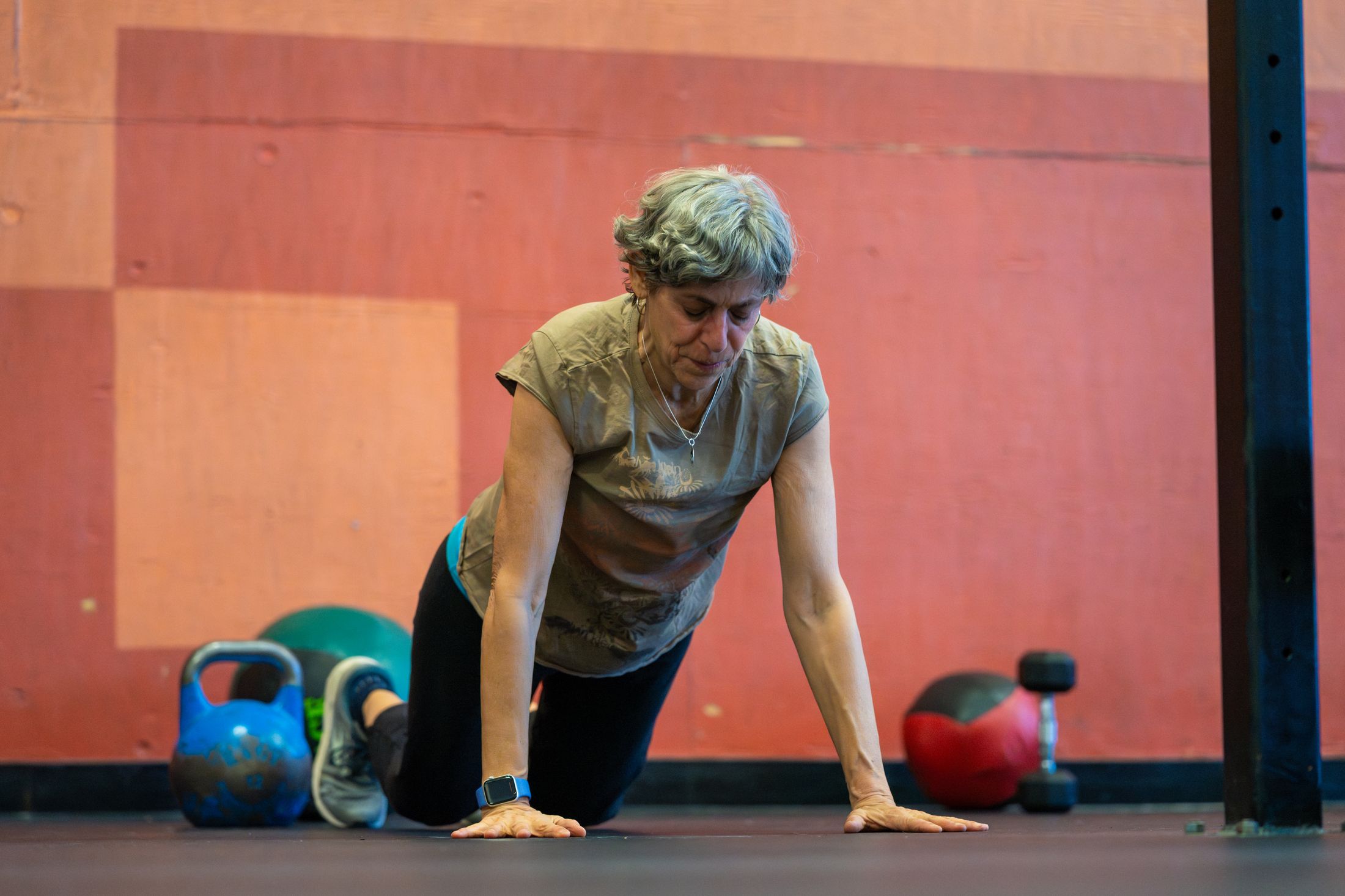 A participant steps out of a plank, focused